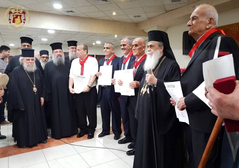 His Beautitude The Patriarch of Jerusalem gives medal awards to choir members of the community of Beit Sahour