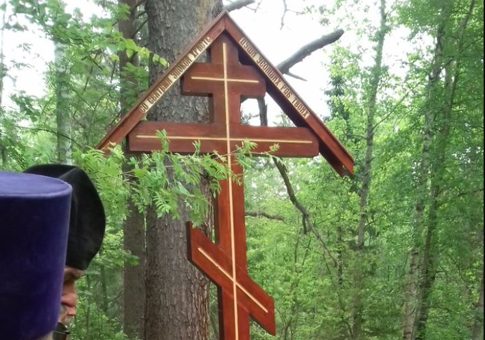Memorial cross erected where 15 monks murdered in 1918 near Perm