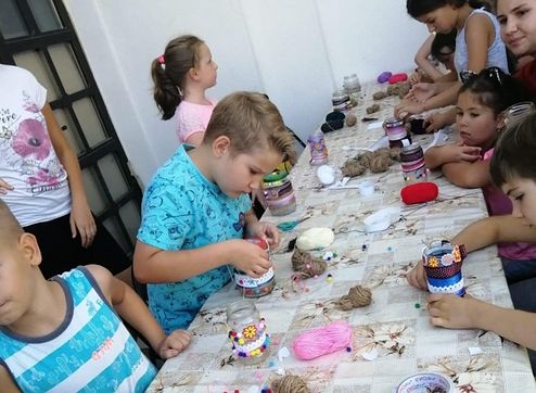 CHILDREN RAISE $2,000 WITH HANDMADE CRAFTS FOR LARGE FAMILY OF NEWLY-REPOSED ROMANIAN PRIEST