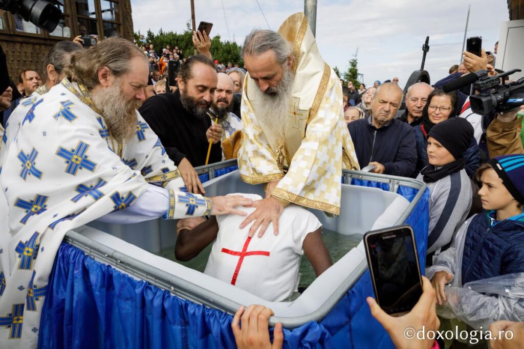 Rwandan young man baptized by Metropolitan Teofan on top of Ceahlău Mountain