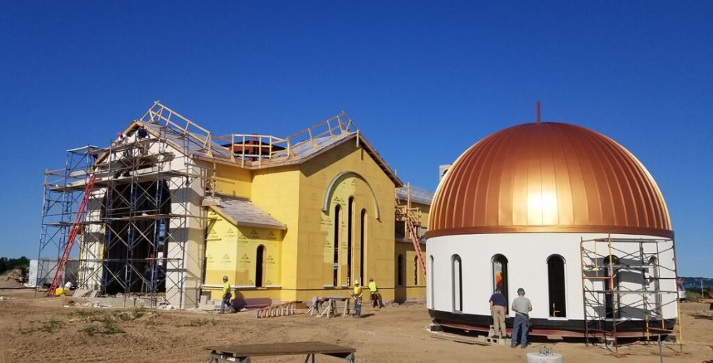 Church construction project moves forward with placement of 42,000-pound dome in Grand Traverse County, Mich, USA