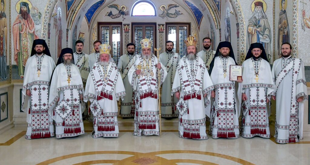 Patriarch Daniel, clergy dressed in vestments with traditional motifs to highlight role of Romanian village