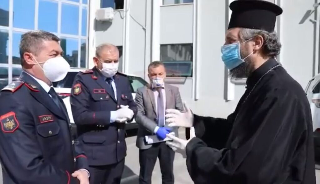 Orthodox Church of Albania helps police with virus protective items