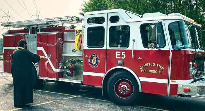 OHIO PRIEST BLESSES FIRE ENGINES ON FEAST OF PROPHET ELIJAH