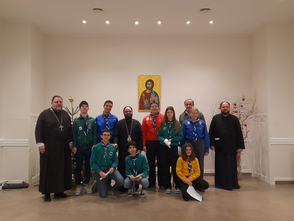 Boy scouts sing Christmas carols to Metropolitan of France