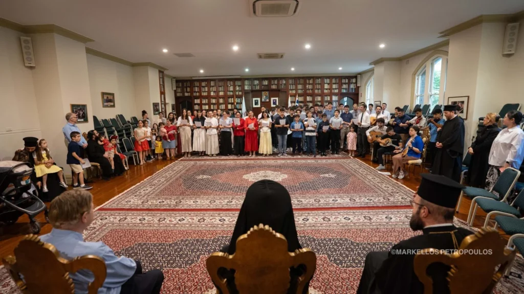Young men and women sang Christmas carols for Archbishop Makarios of Australia